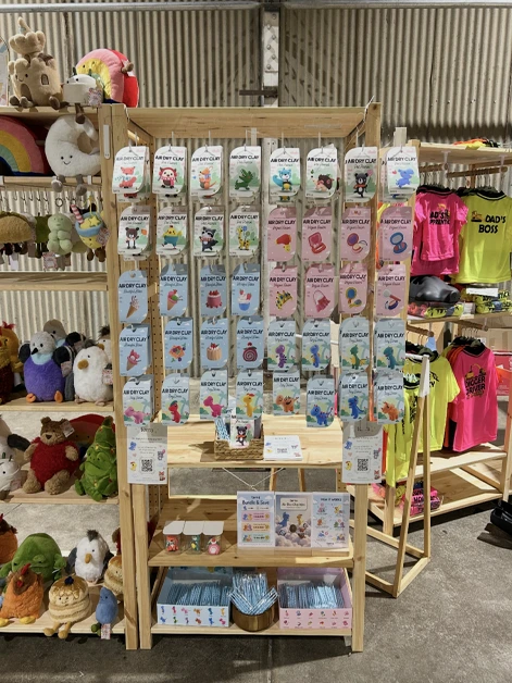 Lumi clay kits hanging on Lollipop Collective's market stall shelf